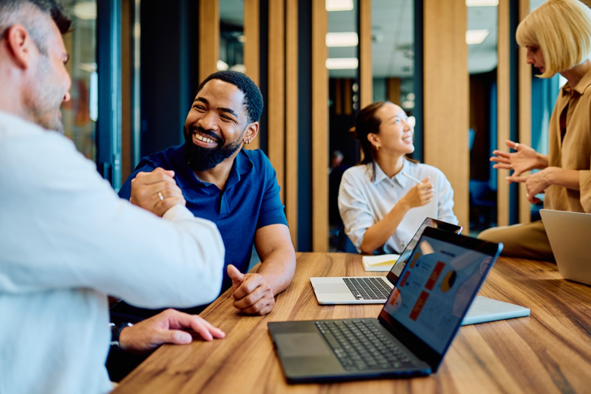 A diverse team in a relaxed, respectful meeting
